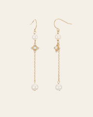 The CAMELLIA Audrey Opal Pearl Earrings feature a gold dangle design with pearl accents, opal details, hook clasps, and a delicate chain. Sterling silver touches add elegance.