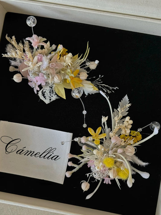 Elegant floral arrangements with pastel flowers and foliage on a black background, featuring customizable elements like a fabric label displaying