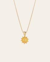 The Elsa Chrysanthemum Citrine Necklace by CAMELLIA features a sunflower-shaped pendant in 14K Gold Vermeil with petal-like details.