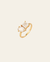 The Etheral Moissanite Band by CAMELLIA features a stunning heart-shaped and square-cut Moissanite set in 14K Yellow Gold Vermeil against a simple light backdrop.