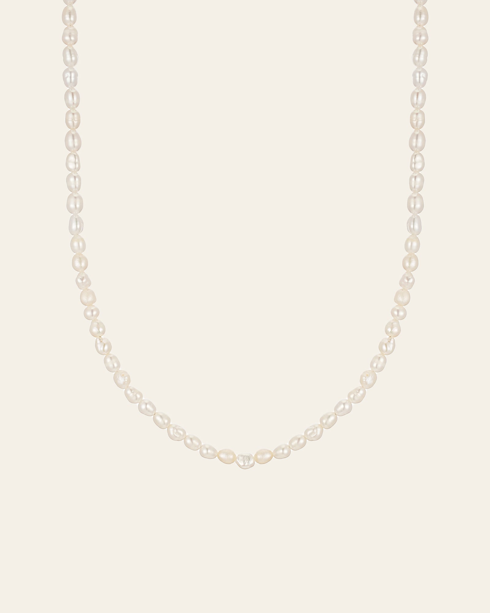 The CAMELLIA 3mm Pearl Chain Necklace features a strand of white pearls elegantly paired with a 14K Yellow Gold Vermeil clasp, set against a plain light background.