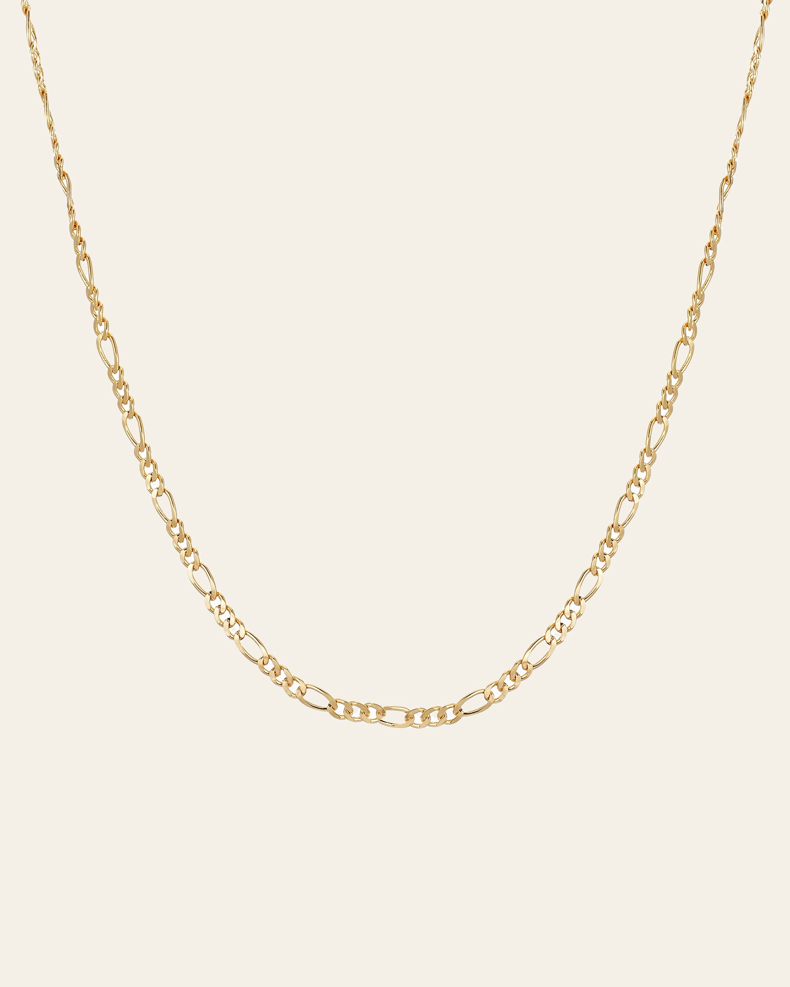 The Isla Chain Necklace by CAMELLIA is crafted in radiant 14K Yellow Gold Vermeil, showcasing stunning alternating long and short links set against a plain light background.