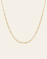 The Isla Chain Necklace by CAMELLIA is crafted in radiant 14K Yellow Gold Vermeil, showcasing stunning alternating long and short links set against a plain light background.