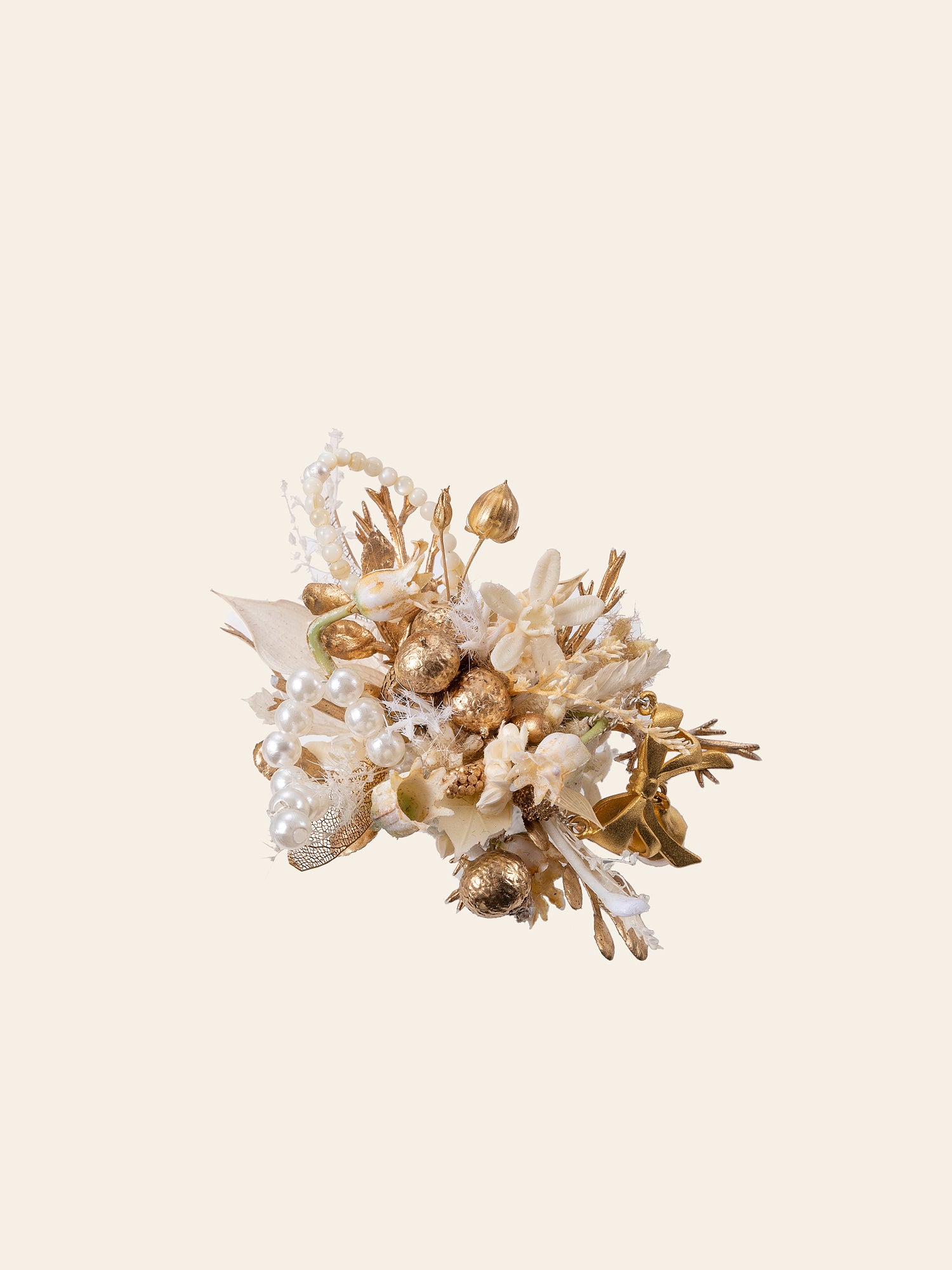 The CAMELLIA Pearl Flower Ring features a stunning handcrafted arrangement of gold and white flowers, pearls, and foliage against a plain background.