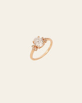 The CAMELLIA Nova Moissanite Band is a 14K Gold Vermeil ring with an oval clear moissanite centerpiece and delicate side accents, shown against a neutral background.
