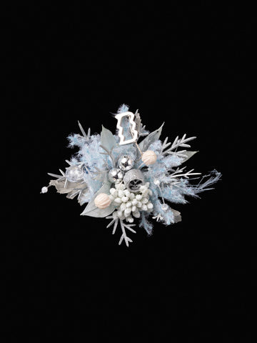 The Aquarius Flower Ring by CAMELLIA features a decorative silver and blue design with leaves, white berries, fluffy textures, and silver baubles on a black background, reminiscent of a handcrafted New York treasure. The Aquarius Flower Ring by CAMELLIA features a decorative silver and blue design with leaves, white berries, fluffy textures, and silver baubles on a black background, reminiscent of a handcrafted New York treasure.