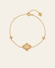 The CAMELLIA Aurielle Opal Bracelet is a yellow gold piece featuring a detailed centerpiece with white stone-adorned square sections and an elegant small heart charm near the clasp.