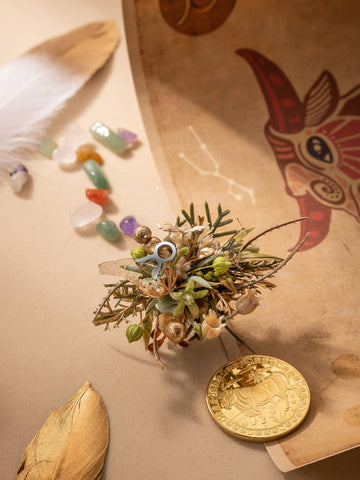 A handcrafted miniature floral arrangement with a seashell, dried plants, tiny cup, gold coin, feather, colorful stones, and animal-illustrated paper is perfect for displaying alongside your CAMELLIA Taurus Flower Ring or adjustable ring. A handcrafted miniature floral arrangement with a seashell, dried plants, tiny cup, gold coin, feather, colorful stones, and animal-illustrated paper is perfect for displaying alongside your CAMELLIA Taurus Flower Ring or adjustable ring.
