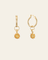 The Elsa Chrysanthemum Topaz Earrings by CAMELLIA, crafted from 14K Yellow Gold Vermeil with sunburst pendants, are displayed on a light background.