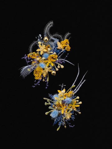 The Van Gogh's Starry Wedding Flower Rings by CAMELLIA showcase vibrant yellow, blue, and purple flowers with dried floral accents, all set against a black background. The Van Gogh's Starry Wedding Flower Rings by CAMELLIA showcase vibrant yellow, blue, and purple flowers with dried floral accents, all set against a black background.