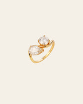 The CAMELLIA Evermine Moissanite Band showcases a large pear-shaped and a smaller round moissanite set side by side in gold vermeil, accented with pavé-set details for extra brilliance.