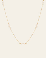 The CAMELLIA Polly Pearl Chain Necklace is a hypoallergenic piece crafted in 14K Yellow Gold Vermeil, showcasing small pearls evenly spaced along its delicate design.