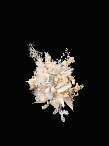 A bouquet of dried white and beige flowers with diverse blooms and grasses evokes the elegance of CAMELLIA's Gemini Flower Ring, reminiscent of a handcrafted New York piece, displayed against a black background. A bouquet of dried white and beige flowers with diverse blooms and grasses evokes the elegance of CAMELLIA's Gemini Flower Ring, reminiscent of a handcrafted New York piece, displayed against a black background.