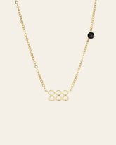 CAMELLIA’s 888 Angel Number Choker features an abstract interlocking loop pendant with a single black onyx bead accent.