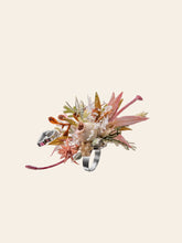 The CAMELLIA Libra Flower Ring is a handcrafted silver piece featuring intricate pink and green floral and leaf designs on a light background. Elegantly adjustable for the perfect fit, it captures the charm of nature's elegance.