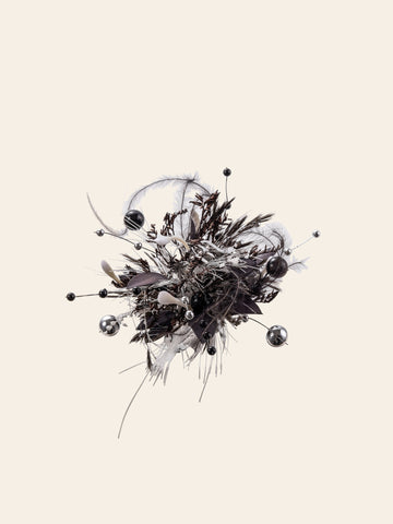 An abstract spherical cluster of feathers, beads, and wires creates a chaotic yet artistic design against a plain background, mimicking the handcrafted Scorpio Flower Ring by CAMELLIA. An abstract spherical cluster of feathers, beads, and wires creates a chaotic yet artistic design against a plain background, mimicking the handcrafted Scorpio Flower Ring by CAMELLIA.