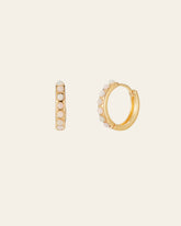 The CAMELLIA Una Opal Hoops are crafted in 14K Yellow Gold Vermeil, featuring white pearls in a line on the outer side, and displayed on a plain light background.