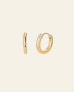 The 15mm Mother Hoops by CAMELLIA, crafted from hypoallergenic 14K yellow gold vermeil, are shown against a plain backdrop. Displayed in both side and front views, these small gold hoop earrings embody elegance and purity with their minimalist design.