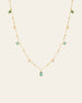 The CAMELLIA Moren Emerald Diamond Necklace showcases small diamond accents and spaced emerald pendants set in 14K Yellow Gold Vermeil.