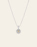 The CAMELLIA Elsa Chrysanthemum Citrine Necklace is sterling silver with a chain featuring a sunflower-shaped pendant, designed with a central citrine November birthstone gem surrounded by clear stones.