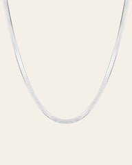 The CAMELLIA 3.5 mm Snake Chain Necklace is elegantly displayed against a plain white background, providing a hypoallergenic touch for sensitive skin.