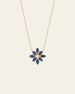 The Cámellia Sapphire Pearl Necklace by CAMELLIA showcases a blue and pearl flower-shaped pendant with seven petals, set against a plain white background.